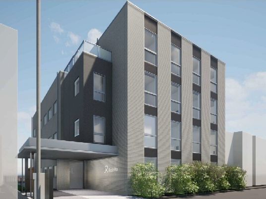 鉄骨造の建物の外観パース。ナーシングホーム南千住の建物の外観