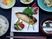 サムネイル 魚がメインの夕食メニュー。彩り豊かな食事の写真