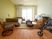歩行器やベッド、エアコンやタンスなどの家具が付いた部屋は明るく、フローリングで段差がない。