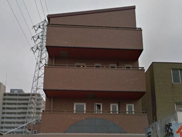 赤茶色の建物の外観 外観 近代的なデザインの建物です。周辺の施設と調和した街並みがご覧いただけます。