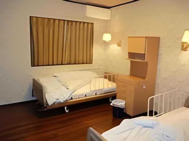 落ち着いた居室 居室 ゆったりとした空間で、落ち着いたインテリアが配された居室です。ベッドが二つ配置されていますので、安心して過ごせます。