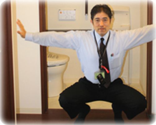 トイレを示す人物