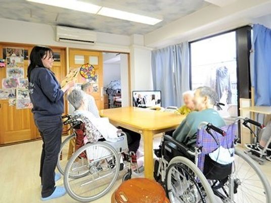 車椅子の方々とスタッフ