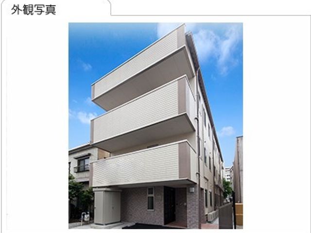 白い外壁の建物外観 外観 モダンな白い外壁が印象的な建物です。周りの環境に溶け込む上品なデザインが特徴です。