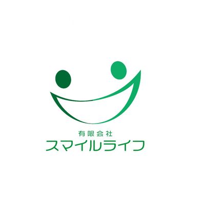 笑顔のロゴと文字看板