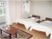 サムネイル テーブルや介護用ベッドが２つ置かれた居室。ご夫婦や兄弟などで入居することが可能な、広い部屋となっている。