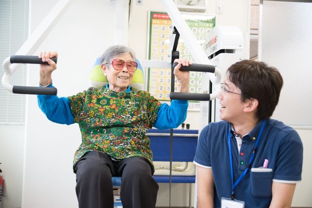 訓練中の笑顔の利用者