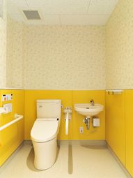 黄色い壁のトイレ空間