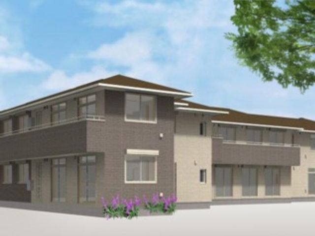 新しい施設の外観 清潔感のある新築の建物が印象的です。周囲には緑も見られ、穏やかな環境でお仕事できそうです。