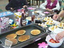 共有スペースでの料理風景
