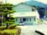 緑に囲まれた建物外観