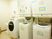 清潔な洗濯機が並ぶ部屋