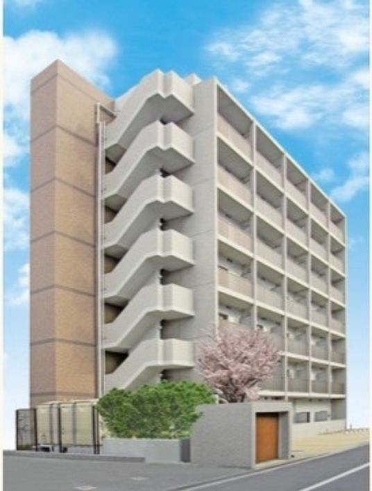 春の桜と共に立つ建物