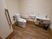 サムネイル 施設の写真 広々とした明るい清潔感のあるトイレである。温水洗浄便座や洗面スペース、ナースコール、手すりが完備されている。