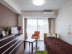 洋室とベッドのある空間