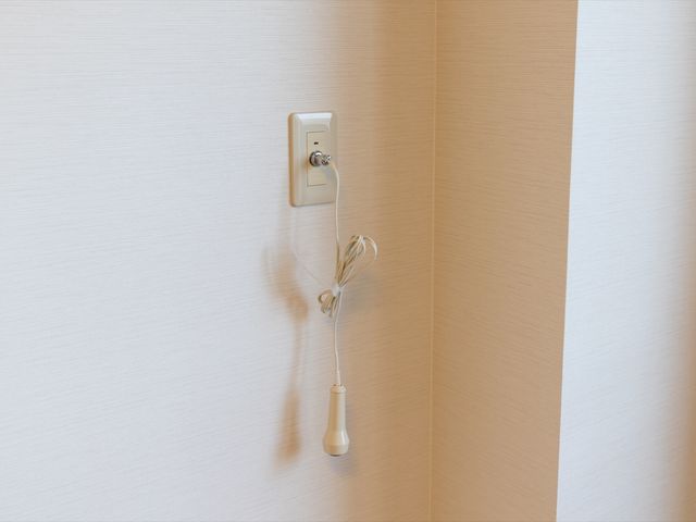 壁に取り付けられたコールボタン
