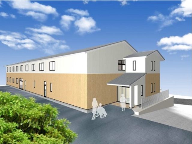 白と木目調の外壁の建物 外観 明るく開放的な外観を持つ建物で、ご利用者が快適に過ごせるよう工夫されています。バリアフリー設計で移動も安心です。
