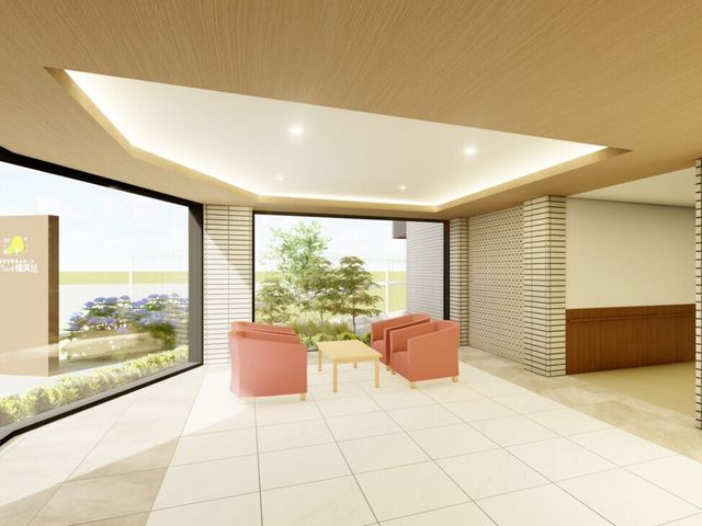 快適な中庭が見えるロビー エントランス 開放的な空間設計のロビーは、緑豊かな中庭を望むことができ、明るく居心地の良い待合スペースを提供しています。