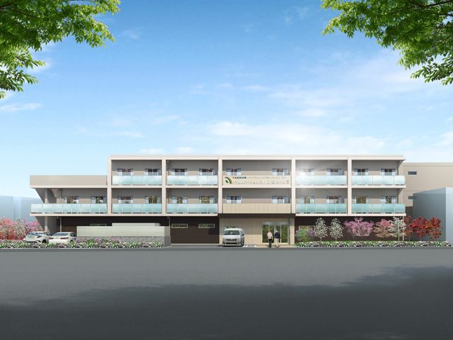 明るい外観の建物 外観 四階建てのモダンな建物で、訪れる方々を温かく迎え入れます。色とりどりの植栽が、彩りを添えています。