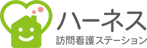 笑顔のロゴが特徴的な看板