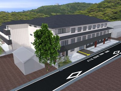 緑に囲まれた建物外観