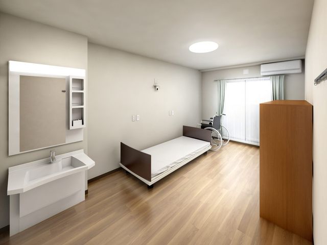 居室の明るい空間 居室 洗練されたデザインの個室です。ベッドや洗面台が備え付けられ、快適な個人空間を提供します。