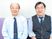 スタッフ2人が並ぶ室内  