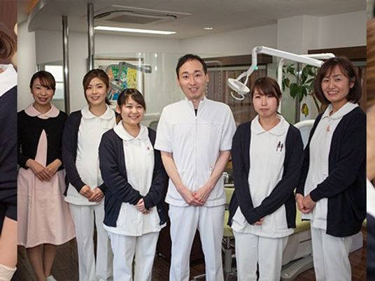 スタッフが並ぶ機能訓練室  