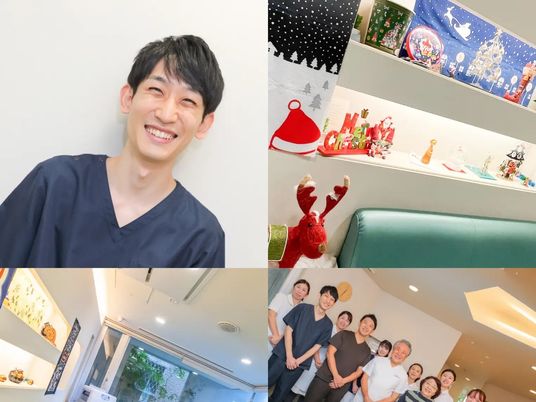 笑顔のスタッフたちが並ぶロビー  