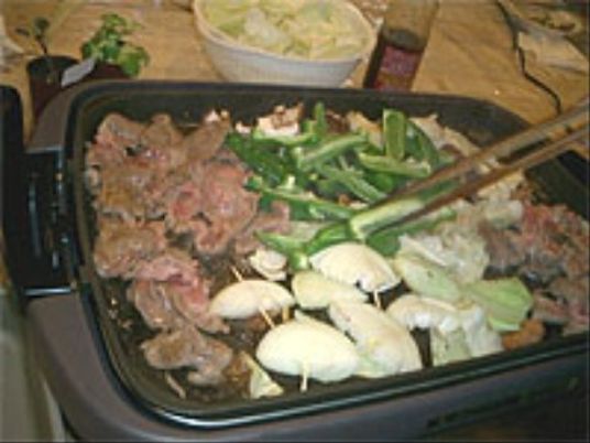 共用キッチンでの料理