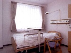明るい居室のベッド  