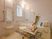 サムネイル 施設の写真 リフトが設置された一人用の浴槽が設置されている浴室にはたくさんの手すりが付いている。