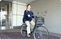 自転車の人物と建物の出入口  