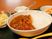 サムネイル 食事の一例。料理は綺麗に盛り付けされており、カレーにはお肉やグリーンピースなど具がたくさん入っている。