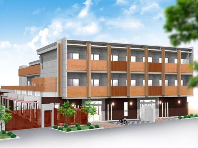 施設の外観 外観   木目調の外壁が印象的な3階建ての建物です。明るい空の下で、落ち着いた雰囲気が伝わります。