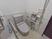 サムネイル 施設の写真 広々としたスペースがあるトイレには手洗い台が設置されている。壁、便器の脇に手すりが取り付けられている。