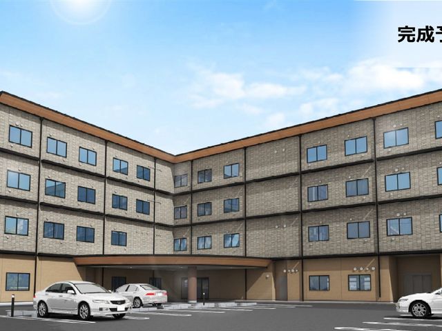 四階建ての建物 外観 広々とした駐車場を備えた四階建ての施設です。仕事への利便性を考慮した設計になっています。