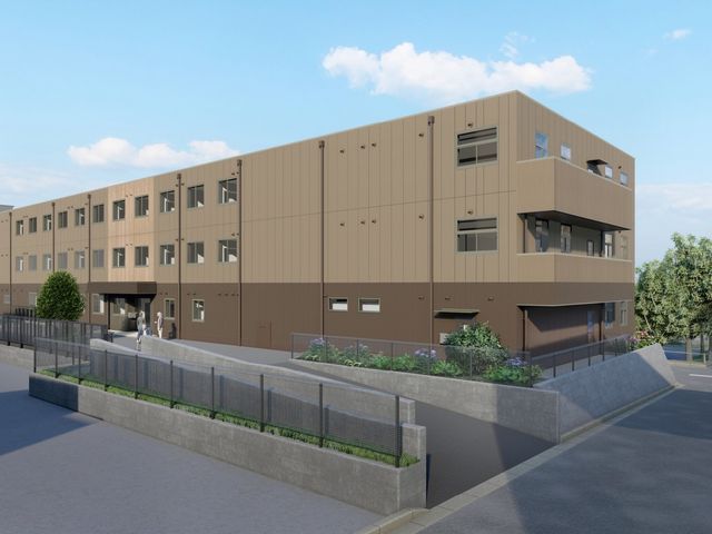 外観の全景 外観   落ち着いた色合いの建物で、段差の少ない出入口が見えます。植栽も整っており、働く場としての動線が確認しやすいです。