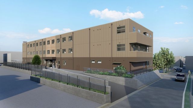 外観の全景 外観   落ち着いた色合いの建物で、段差の少ない出入口が見えます。植栽も整っており、働く場としての動線が確認しやすいです。