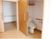 サムネイル スローライフ山梨（介護専用型特定施設入居者生活介護）のトイレ。引き戸タイプの入り口で、床はオールフラット仕様になっている。