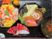 サムネイル 施設の写真 八角形の重箱に入れられたお食事。メインのちらし寿司の他に汁物も用意されている。お弁当の周りに可愛らしい装飾がされている。